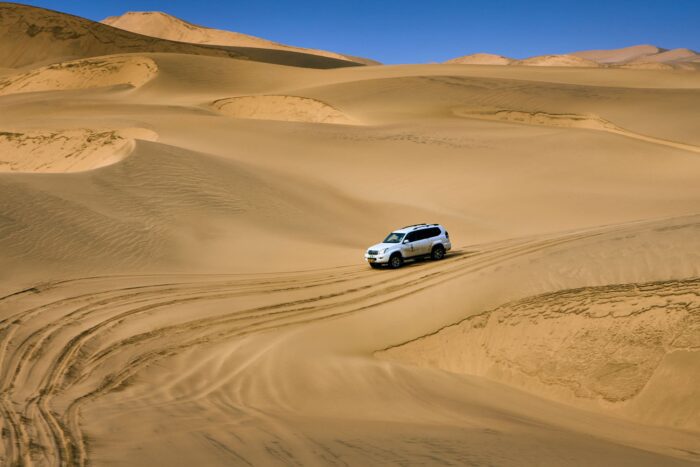 Car driving in the dunes